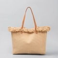 Light brown woven straw tote bag with brown leather handles and fringe trim detail - Khaki