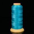 Lake blue braided thread on yellow spool for jewelry making and necklace weaving - Lake Blue