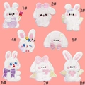 Detailed close-up showing eight cartoon rabbit embroidered patches with diverse expressions - Self-Adhesive Plush Rabbit Set (8 Pieces)