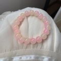 Detail of pink and yellow gradient crystal beaded bracelet on white silk fabric background - Gradient-Pink Yellow