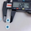 Blue and white Evil Eye shell bead showing 12.0mm diameter on digital caliper - 12mm