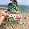 Cream canvas tote bag with yellow stripes and cartoon bear print in beach setting - Happy Family