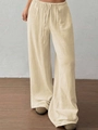 Détail du pantalon large beige montrant la texture lin et la taille avec cordon - S / Beige