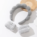 Detail of grey sponge spa headband and matching plush wristbands on white background - Grey Headband And Wristbands Set