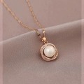 Detailed macro view of a rose gold wheat pearl pendant with micro-set cubic zirconia crystals - Shining Zirconia Pearl Necklace-Rose Gold