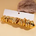 Set van 10 vergulde ringen met gladde en gestructureerde minimalistische ontwerpen - Stalen Pin - Milieuvriendelijk Goud (20-delige Set)