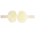 Detail of cream chiffon bow headband with elastic mesh strap for newborns and infants - Beige