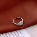 Macro shot of the vintage clover ring with cat-eye gemstone and micro-pave zircon detail - Silver Micro-set Round Bead Green Gemstone Style