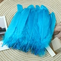Detail of natural blue goose feathers on woven mat for DIY dreamcatcher crafts - Stiff Lake Blue (50Pcs)