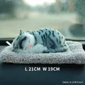 Realistic gray and white plush cat toy on purple cushion measuring 21cm by 19cm - Large Grey Tabby Cat