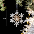 Detail of 11cm acrylic snowflake ornament with gold sequins on a Christmas tree branch - Snowflake No.4