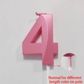Pink geometric number 4 birthday candle with white stake on grey background - Number 4 / Pink