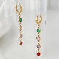 Detail of long gold drop earrings featuring vertically set green, pink, purple, and red zircons - Gold