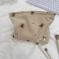 Detail of cute bear corduroy makeup bag with soft texture and chic desktop styling - Khaki
