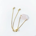 Detail of adjustable gold-tone chain bracelet with natural raw pink crystal and rhinestones - Rose Quartz