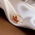 Adjustable gold plated maple leaf ring with orange and red gemstones on beige silk - Maple Leaf Style (H015)