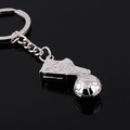 Polished silver metal keychain featuring a miniature soccer ball and a football cleat - Football and Soccer Shoe Style (GX-139)