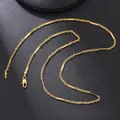 Detail of gold-plated stainless steel bamboo chain featuring a classic lobster clasp - Interrupted Bamboo Chain (8) / Gold