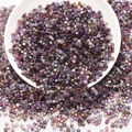 Assorted purple glass square beads in a white bowl for DIY jewelry and crafts making - Purple Series