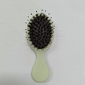 Mini light green portable scalp massage hairbrush with black pins and round tips - Elastic Paint Yellow Bristle