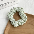 Detail view of floral scrunchie with green polka dots on white chiffon fabric texture - 20# White Green Polka Dot
