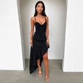 Detailed view of black satin slip dress with ruffled high-low hem and sleek fabric texture - XS / Black