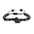 Macro detail of blue sandstone bead bracelet with wolf head charm and woven cord - Blue Sandstone Penguin (Woven Rope)