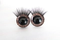 Pair of 3D doll eyes with brown glitter pupils and long black eyelashes on white surface - Brown / 14mm