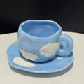 Irregular handmade ceramic coffee cup and saucer set featuring blue sky and white clouds design - Light Cloud Cup & Saucer