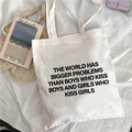 White canvas tote bag with black typography print on a minimalist aesthetic background - Equality Related English Slogan