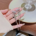 Elegant silver star tassel earrings with rhinestones held in a cozy cafe setting - Star Tassel Style (925 Silver Needle) / Silver