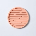 Thick round silicone cup coaster in salmon pink color with non-slip heat-resistant stripes - Drain Style / Pink