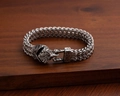 Vintage silver Viking style metal braided bracelet with embossed animal head buckle - Sharp Beak Bird Head