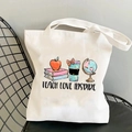 White canvas teacher tote bag with Teach Love Inspire print on black chair - STD374-R Illustration Mix/TEACH LOVE INSPIRE