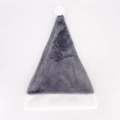 Detail of gray plush Christmas hat featuring a white faux fur pompom and soft trim - Gray