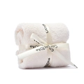 White coral fleece towel roll shaped as a cake gift with a ribbon for wedding favors - White