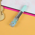 Lipstick-shaped stationery pen in mint green with blue, yellow and pink glitter stars - Lake Blue