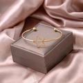 Gold-tone open cuff bracelet featuring a hollow star design and metallic bead accents - Star Style (S278-1)