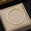Gold tennis bracelet featuring rectangular clear zircons with a secure folding clasp - Gold Tone White (With Extension)