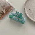 Detail of blue-green marble acetate claw clip with a hollow rectangular hair accessory design - Large Square Claw / Floral Green