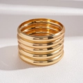 Close-up of five-piece minimalist gold geometric bangle set with polished metallic finish - Gold 5-Piece Set