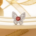 Silver butterfly ear stud with a central red zircon and sparkling clear gemstones - Garnet Red