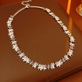 Close-up of silver zircon square chain necklace on premium brown leather surface - Necklace - Silver