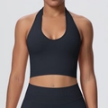 Close-up of black halter yoga bra featuring breathable ribbed texture and seamless design - Black