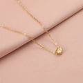 Detailed view of a gold shell pendant necklace on elegant pink fabric background - 18K Gold Plated 2#