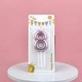 Metallic pink number 8 birthday candle with balloon texture on a pink background - Number 8 / Pink