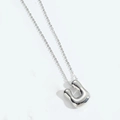 Minimalist silver bubble letter pendant necklace with a polished metallic mirror finish - Letter U