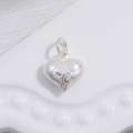 Macro detail of S925 silver heart pendant with textured grid and polished surface - Silver Bumpy Texture Heart Pendant