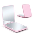 Pink portable folding makeup mirror showing dual-sided design with LED ring light detail - Pink