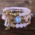 Boho-Armband-Set mit rosa Kristallperlen und goldenen Quasten-Anhängern - Rosa